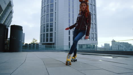 focused roller skater riding outside. active woman training on rollerblades.