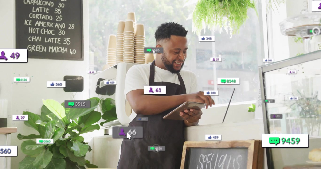 Barista tapping tablet causing engagement data floating typing laptop reading slip managing orders