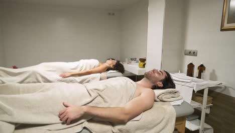couple enjoying a relaxing spa experience on massage tables