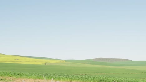 general view of countryside landscape with fields and mountains