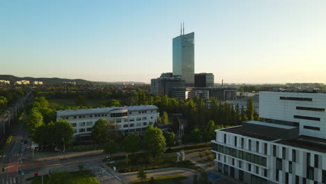 sunrise over gdansk neighborhood university of gdansk and oliva business center, slowly dolly aerial flight, poland