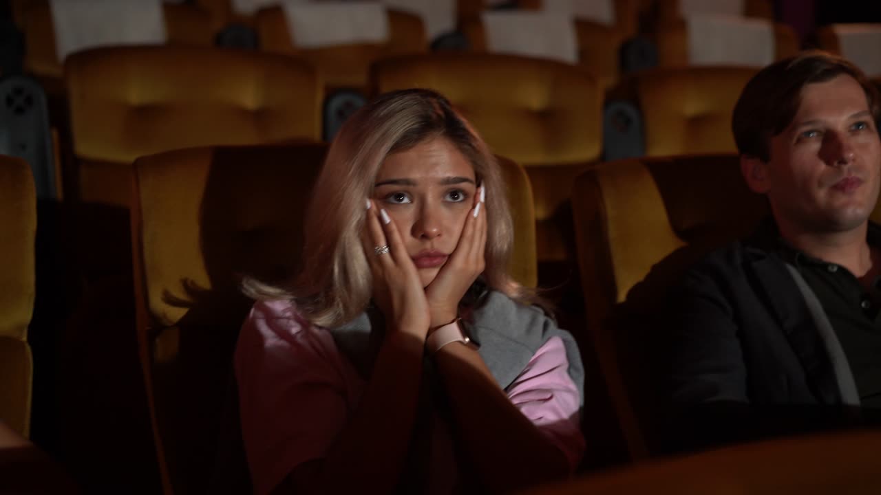 People audience watching movie in cinema theater.