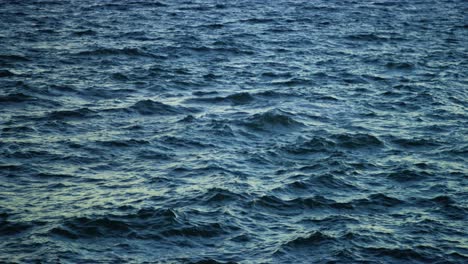 open ocean waves crashing at sea