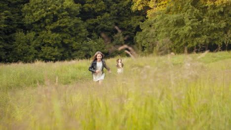 sisters running in a field