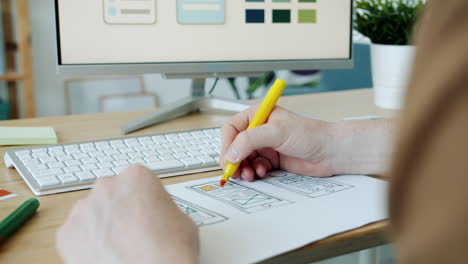 Person designing user interface mockups