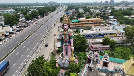 aerial shot of hanuman on highway to vijayawada city