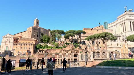 visitors explore historic ruins in rome, italy