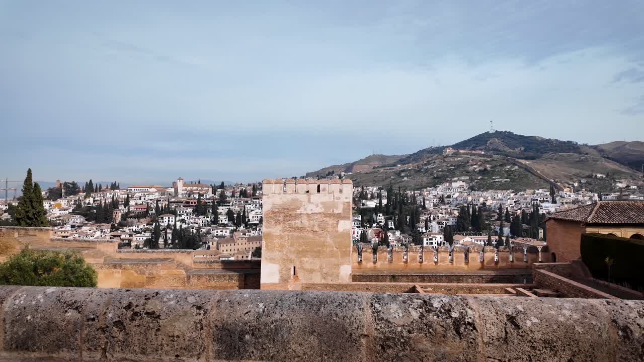Panoramic shot of the city of Granada with the Sierra Nevada mountain range in the background, as seen from the Alhambra