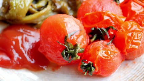 baked tomato and capsicum on plate ,