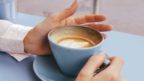 businesswoman having cup of coffee