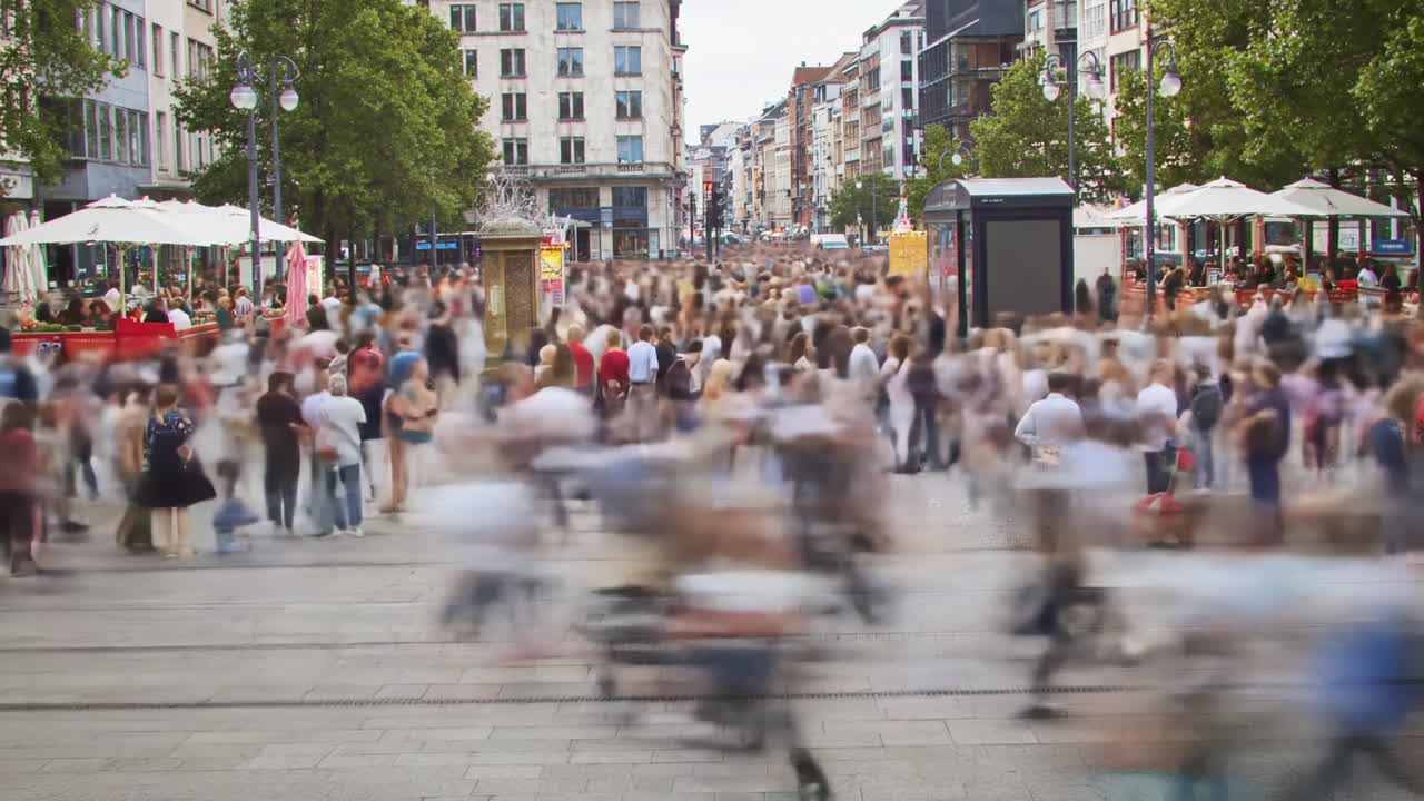 A Busy Urban Scene Capturing the Vibrancy of City Life Through Movement and Activity, Showcasing a Crowd of People Engaged in Daily Routines and Interactions