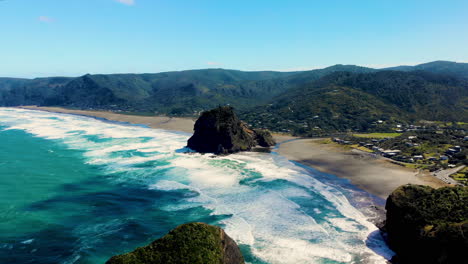 aerial overview of beautiful and wild piha beach, new zealand