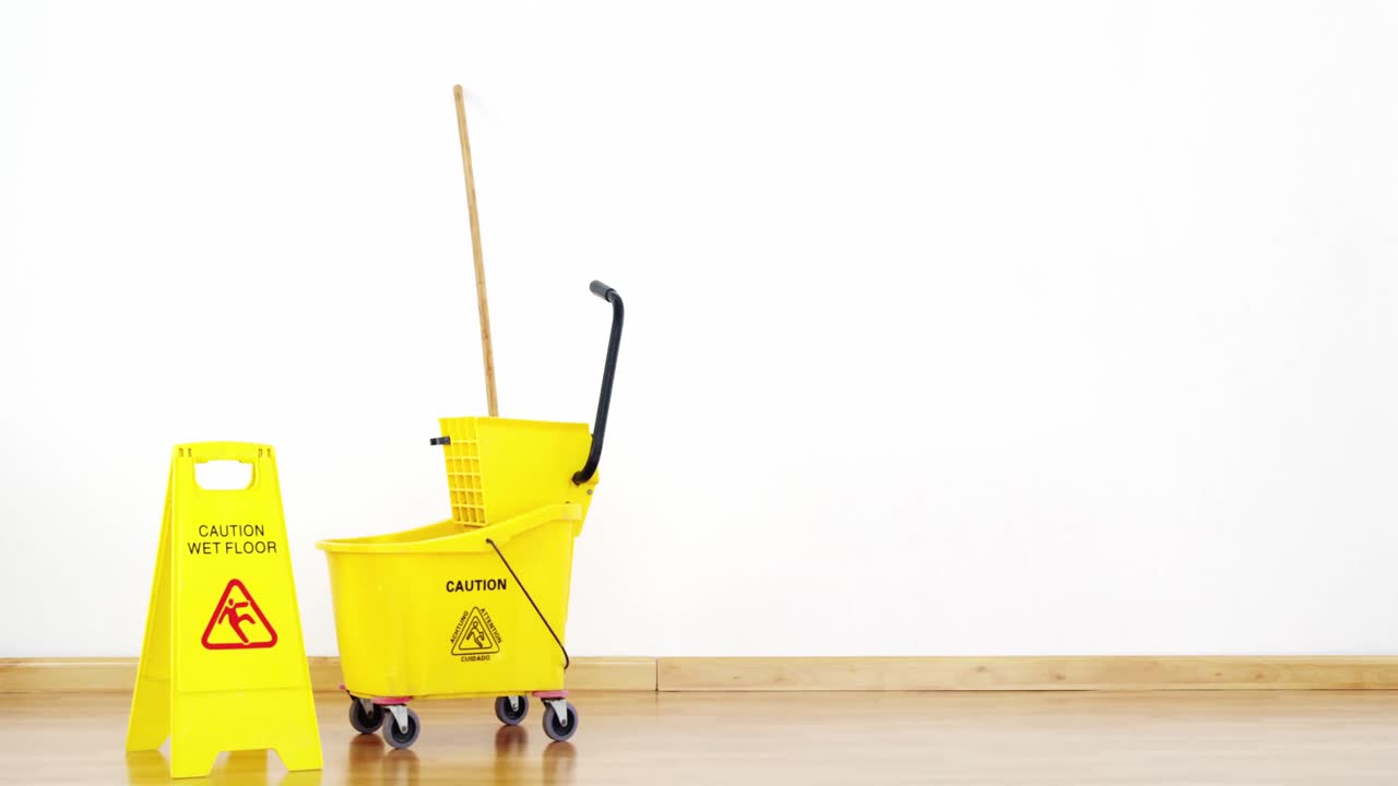 Mopping bucket with caution sign