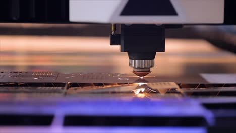 CNC-Laser-cutting-of-metal-in-slow-motion,-modern-industrial-technology.