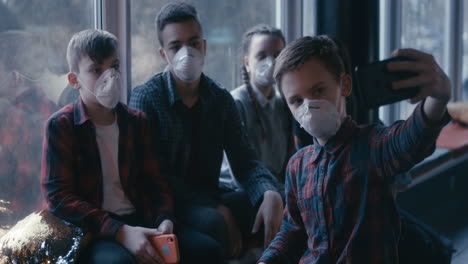 teenagers taking selfie while wearing masks