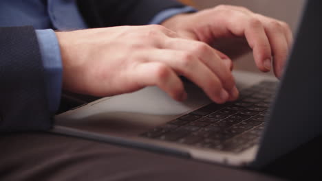 businessman typing on laptop at remote office