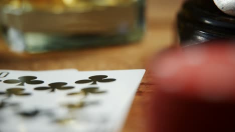 Playing-cards-and-glass-of-beer-on-poker-table-4k