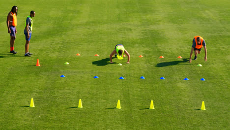 football players exercising in the field 4k