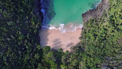 aerial descending secret hidden exotic sand beach on a caribbean island, nobody