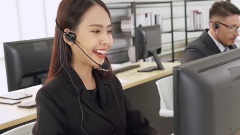 business people wearing headset working in office