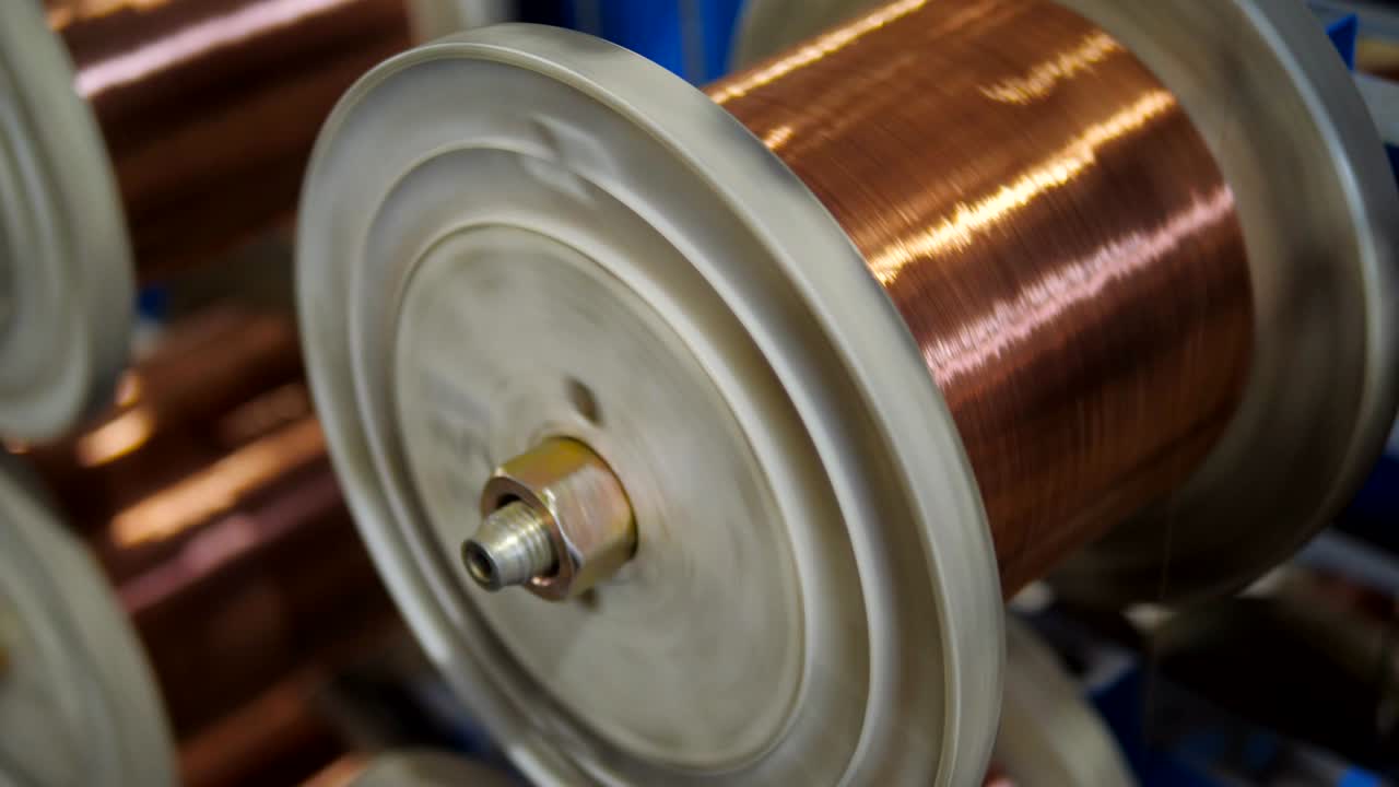Copper winding Wire Manufacturing Process, close up. Electric cable production plant.