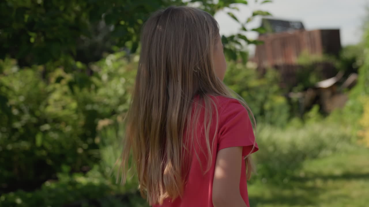 Girl Observes Nature, Young Woman Contemplating Outdoors, Female Silhouette In Lush Garden Scenery, Caucasian Female Figures Against Vibrant Foliage During Peaceful Summer Moment Of Reflection