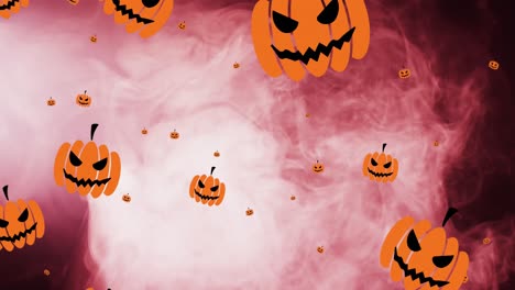 Animation-of-halloween-pumpkins-over-pink-smoke-background