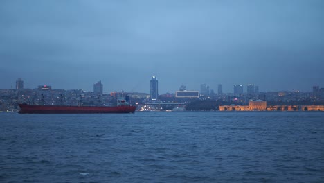 istanbul skyline at dusk with cargo ship