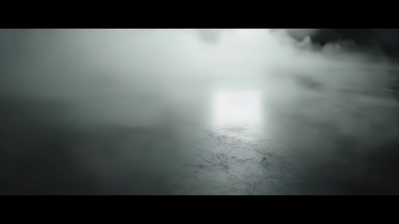 Thick White Fog Rolling Over a Dark Reflective Surface