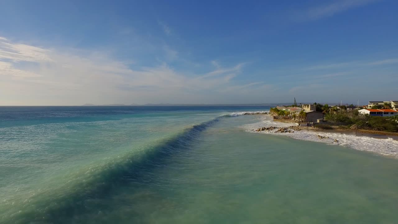 Coastal Scenery with Waves and Buildings