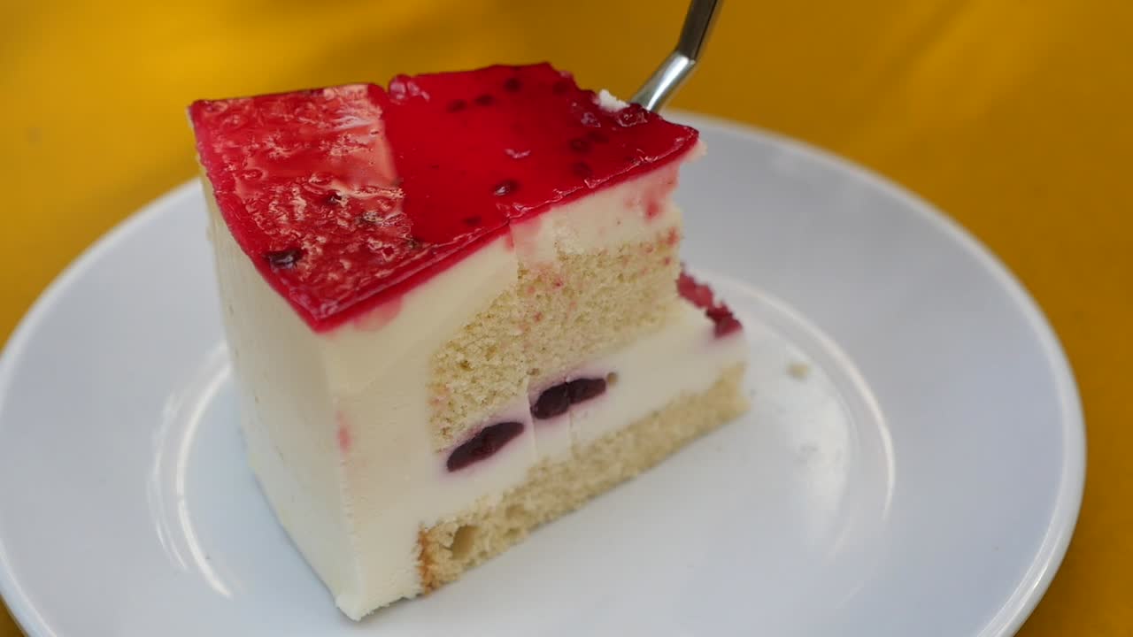 Slice of Cake with Red Glaze and Cherries