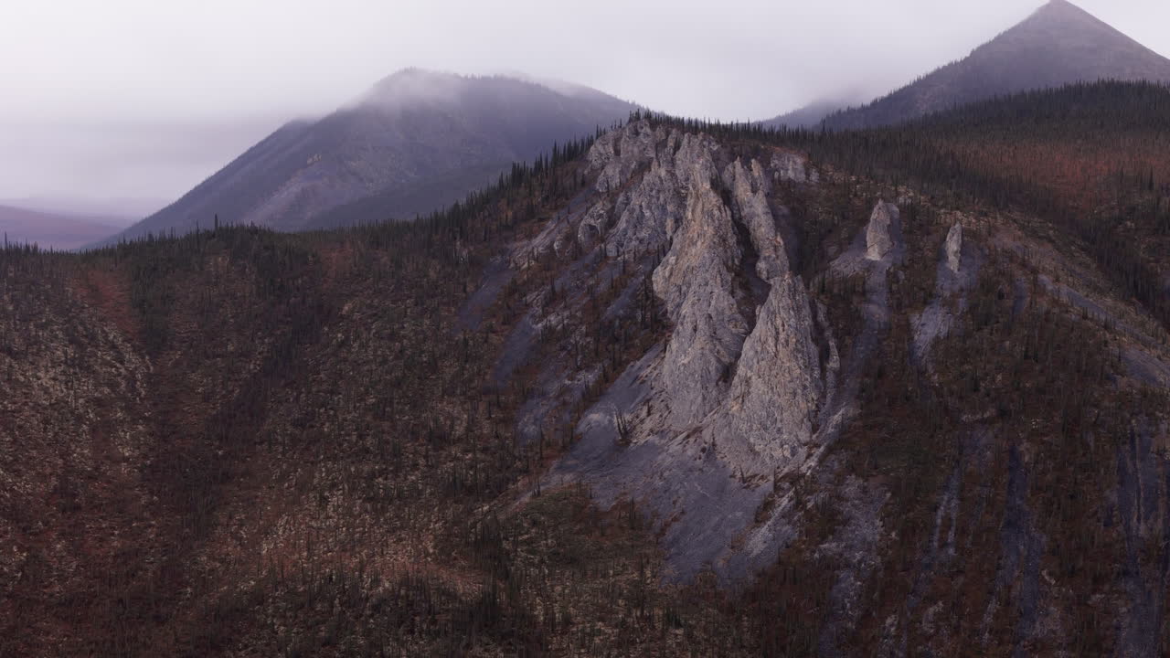 Sharp Cliff On Sapper Hill During Autumn In Yukon, Canada. aerial shot