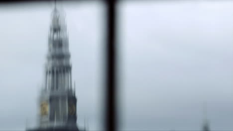 Abstract-view-of-ols-church-in-the-Red-Light-district-of-Amsterdam-through-the-window-in-winter