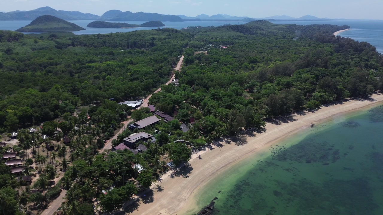 Aerial view of tropical road through palm trees on Koh Jum Thailand with ocean view and coastal landscape creating scenic island travel atmosphere in Southeast Asia.
Surrounded by untouched nature.