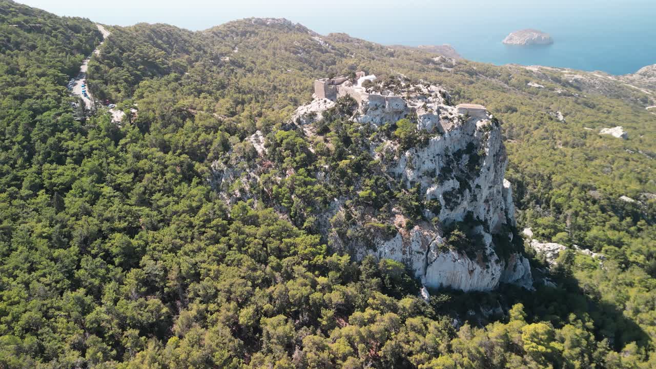 Stunning Monolithos Castle aerial drone rotate and approach from far, Rhodes, Greece