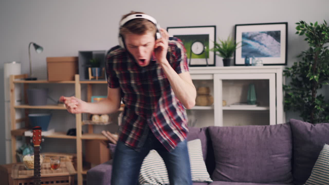 Man Dancing to Music at Home