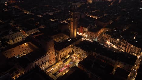 aerial rotating drone view of piazza dante verona at night