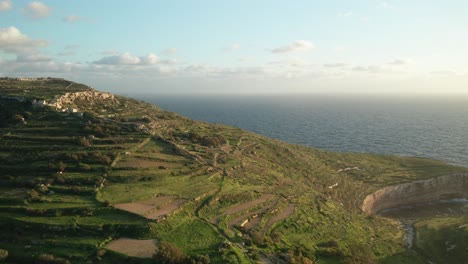 aerial: revealing white cliffs of malta coastline during winter near mediterranean sea