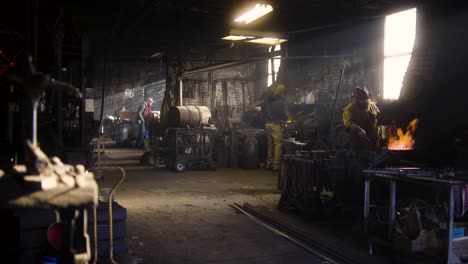 blacksmiths working in a forge