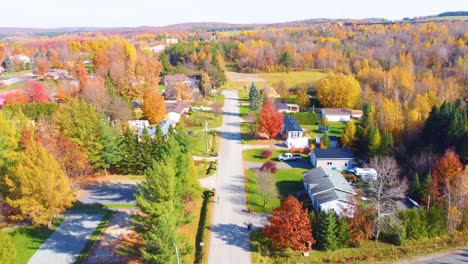 scenic aerial view of a suburban street in estrie, québec, surrounded by autumn colors