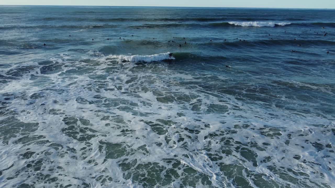 Ocean waves with surfers