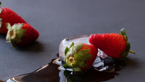 strawberry fruit display commercial over ice melting freezing time lapse