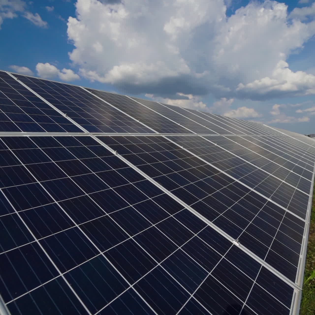 Close-up of solar panel collecting sunlight. Ecology innovation of clean sun energy. Long solar device on the field.