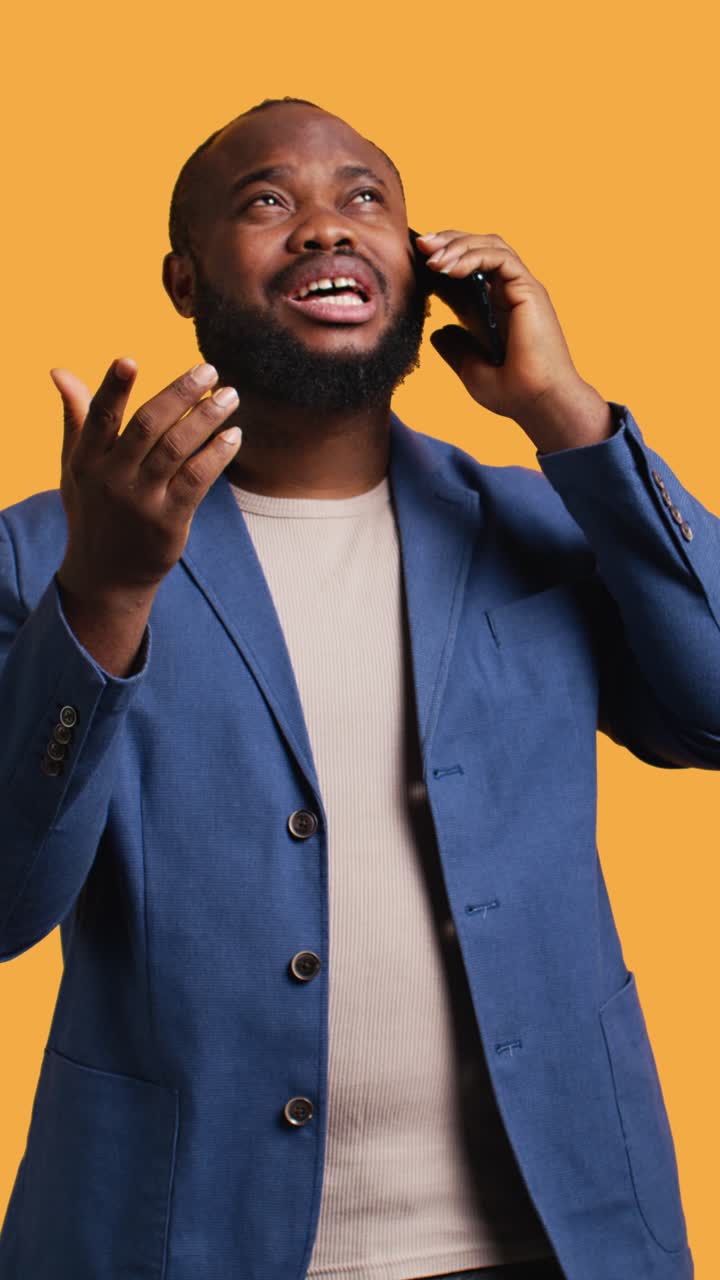 Vertical video Man having thoughtful conversation with friend during telephone call