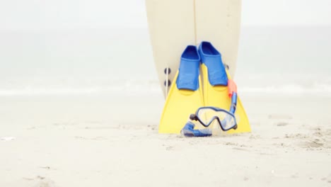 View-of-snorkeling-equipment-and-surfboard