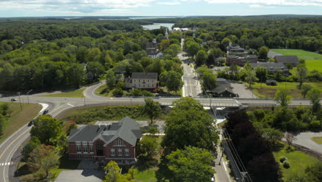 Fly-Over-Reveal-Drone-Footage-at-Yarmouth-Downtown,-Maine,-looking-out-into-the-ocean