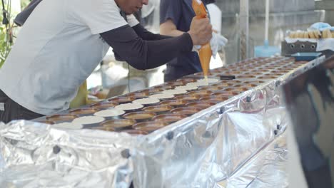 Delicious-food-being-made-on-a-hot-summer-day-at-a-matsuri,-festival,-in-Kyoto,-Japan-soft-lighting-slow-motion-4K