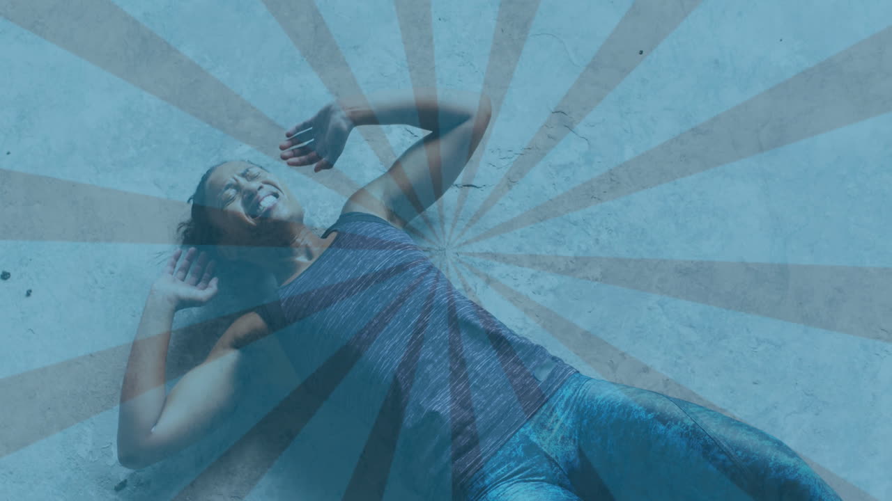 Animation of spinning shapes over woman doing push ups