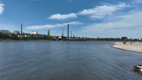 industry along the rhine river, industrial factory, chimneys, smoke stacks. aerial view.