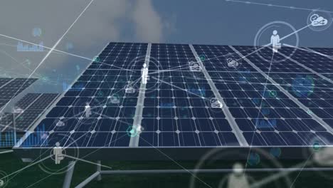 animación de una red de iconos digitales y procesamiento de datos a través de paneles solares y molinos de viento giratorios